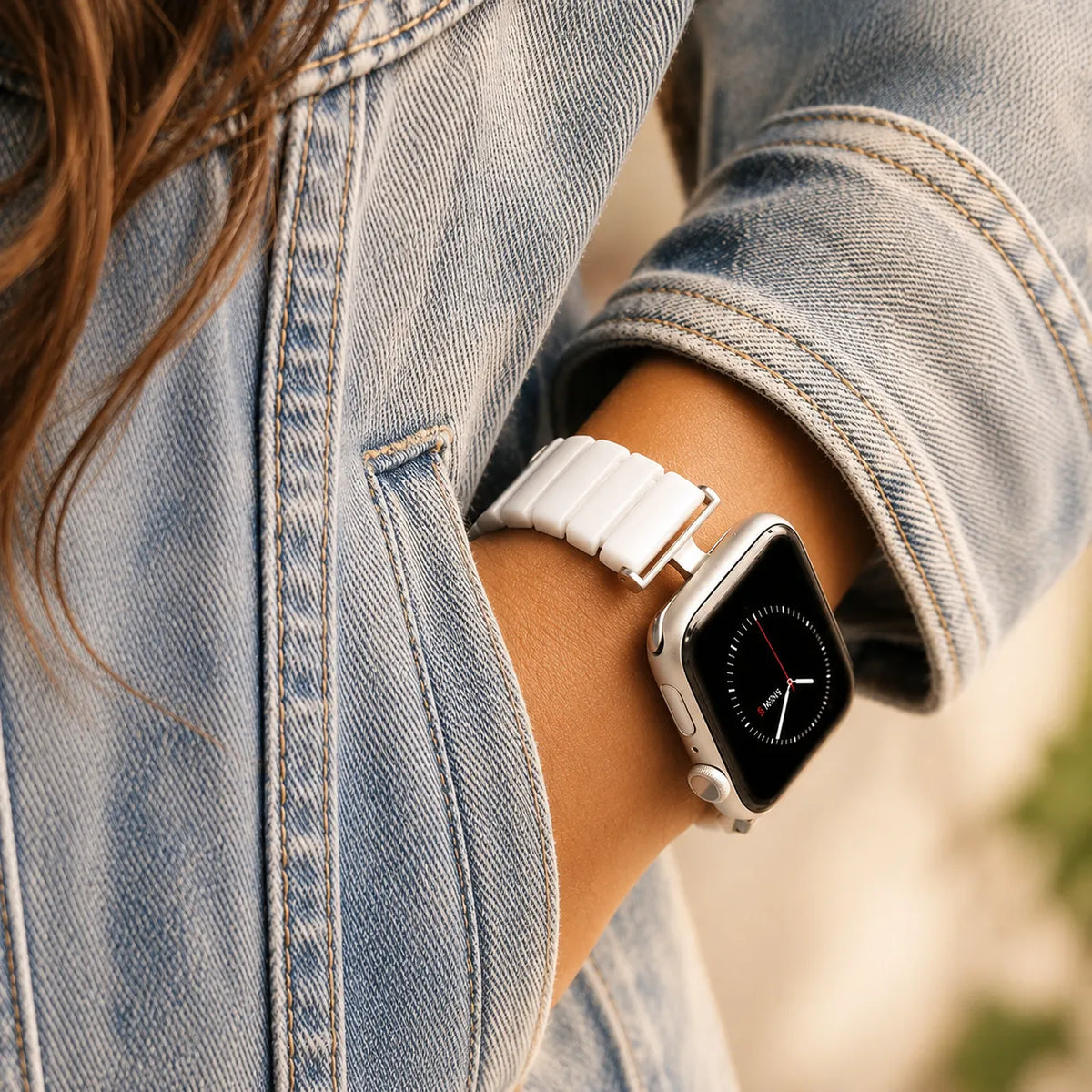 Modern white ceramic link Apple Watch band with silver-tone end details