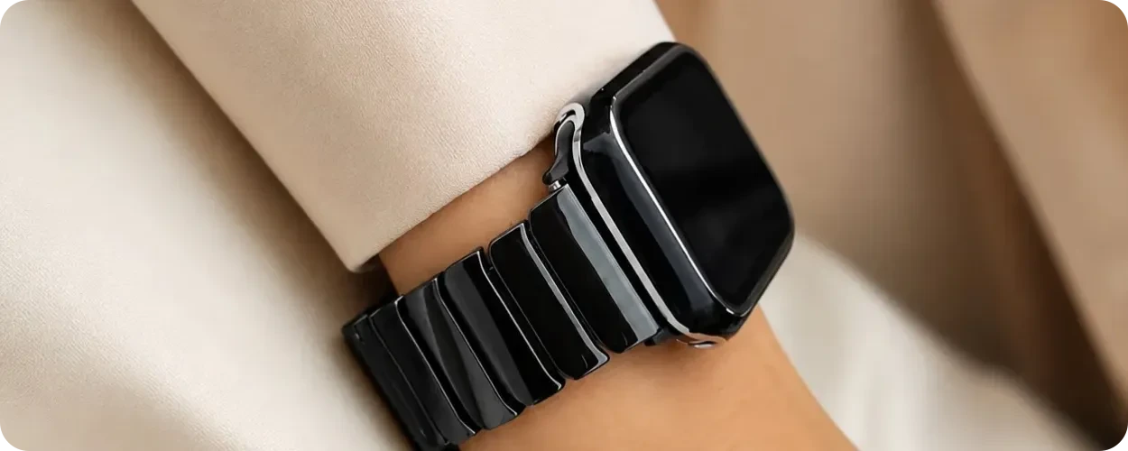 Black ceramic Apple Watch band resting against the wrist