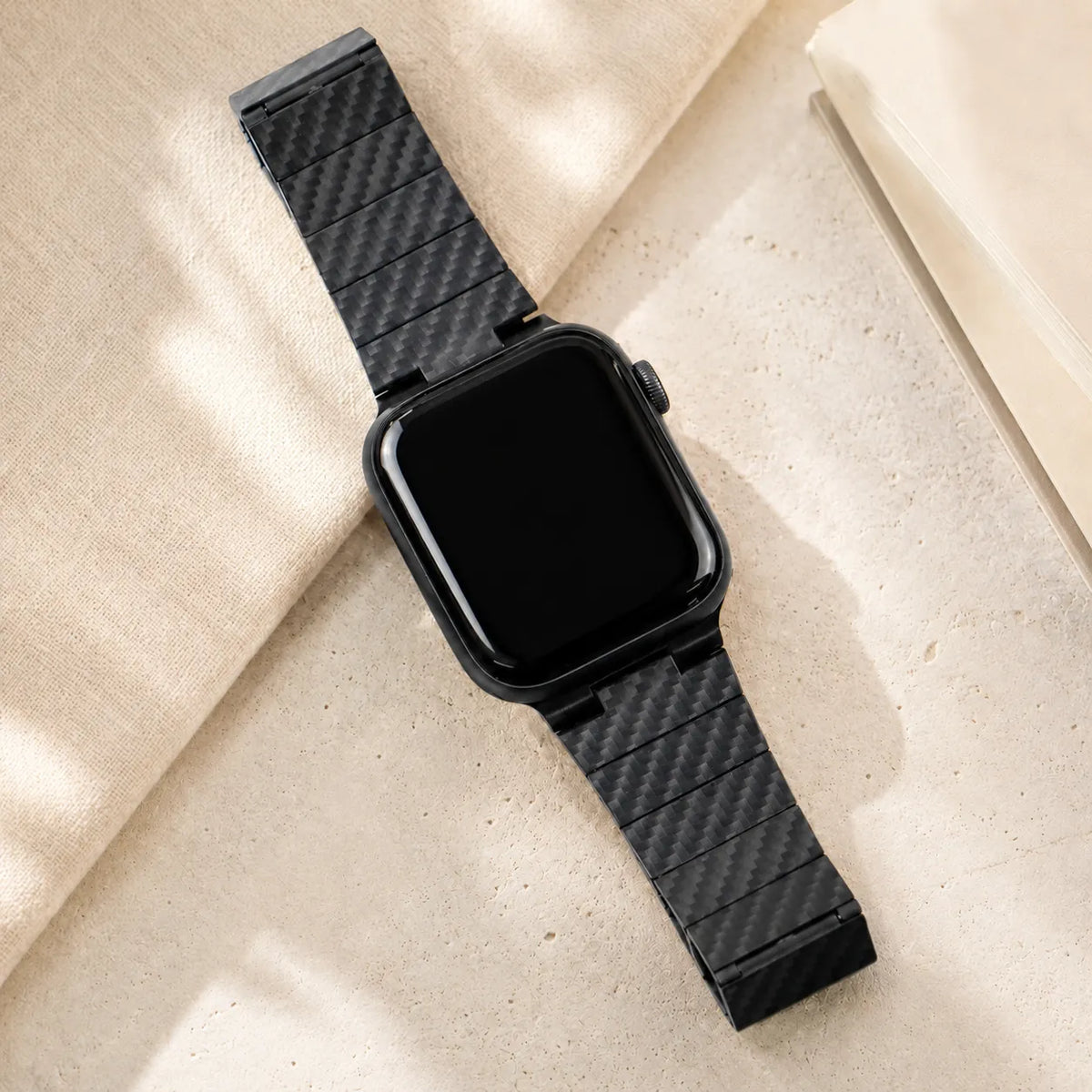 Close view of the woven carbon fiber surface and segmented band construction