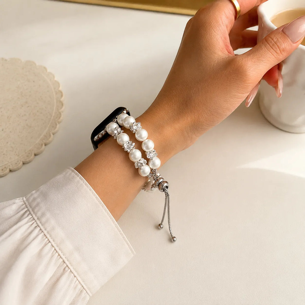 Pearl and crystal floral Apple Watch bracelet worn on the wrist