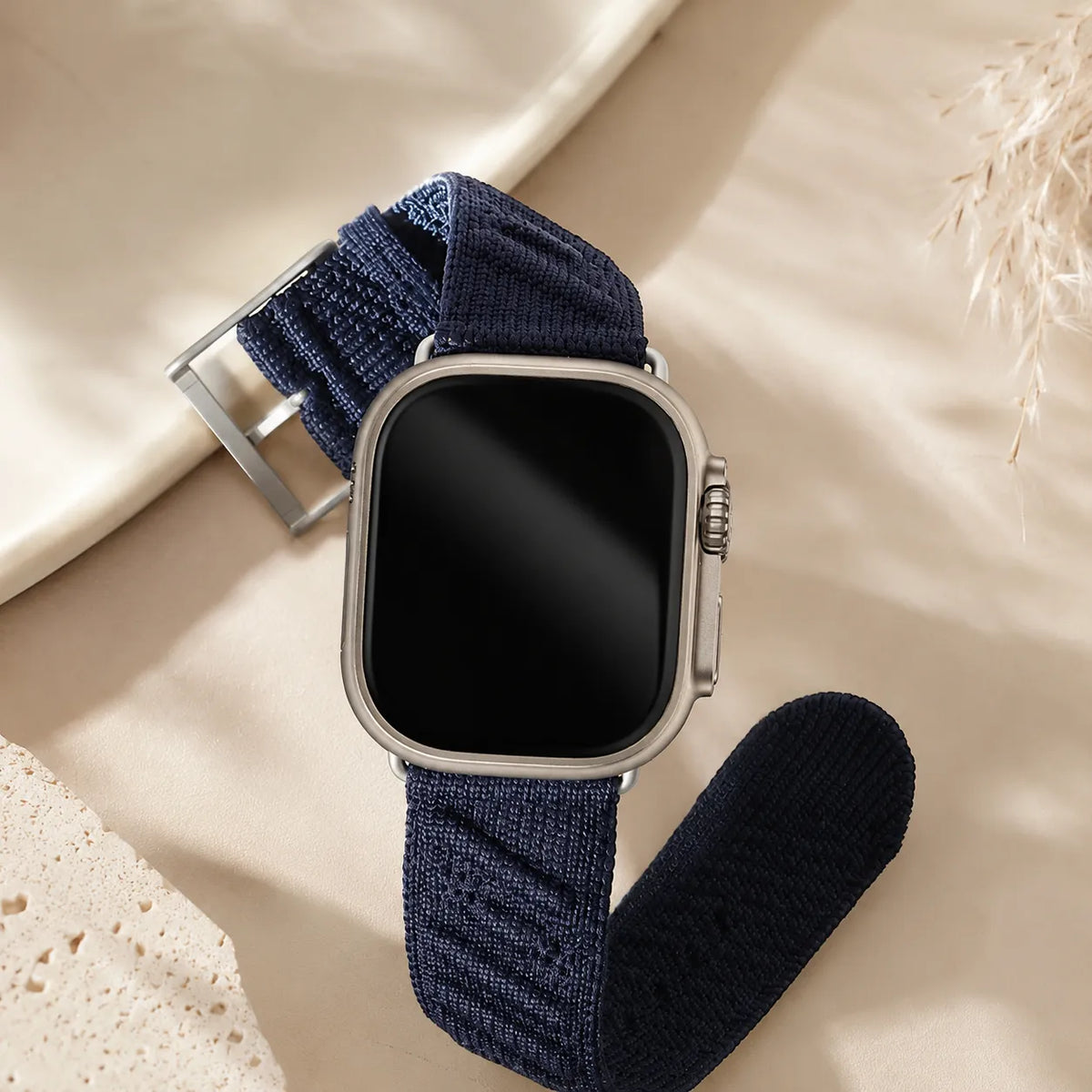 Close view of the raised diagonal texture on a blue knit nylon Apple Watch band
