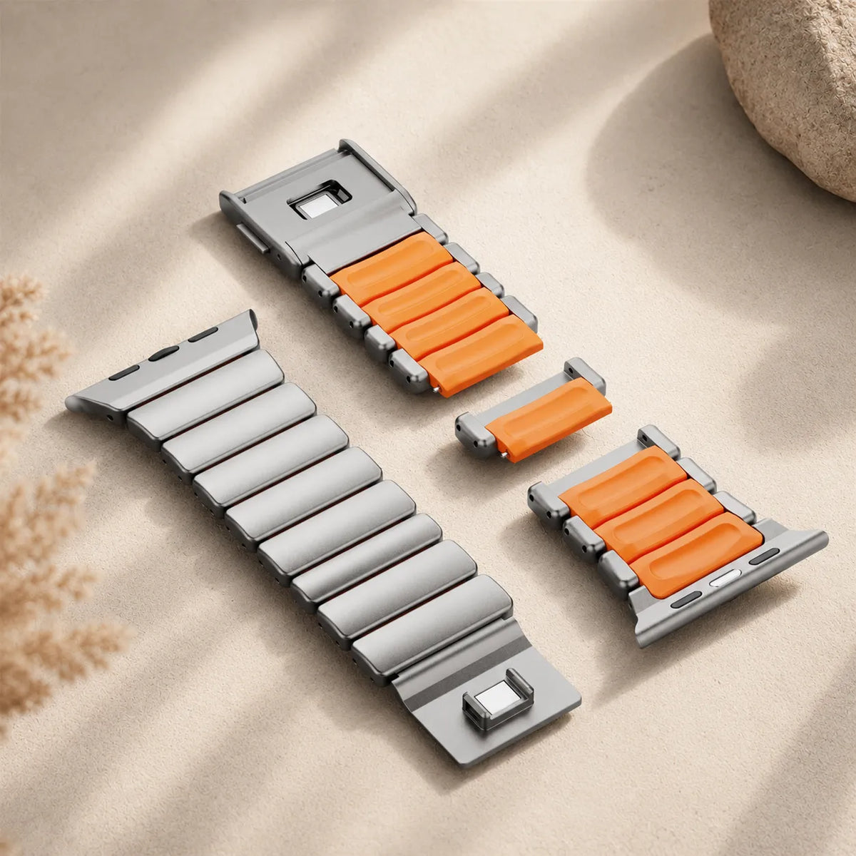 Removable metal and orange silicone links shown apart for band adjustment
