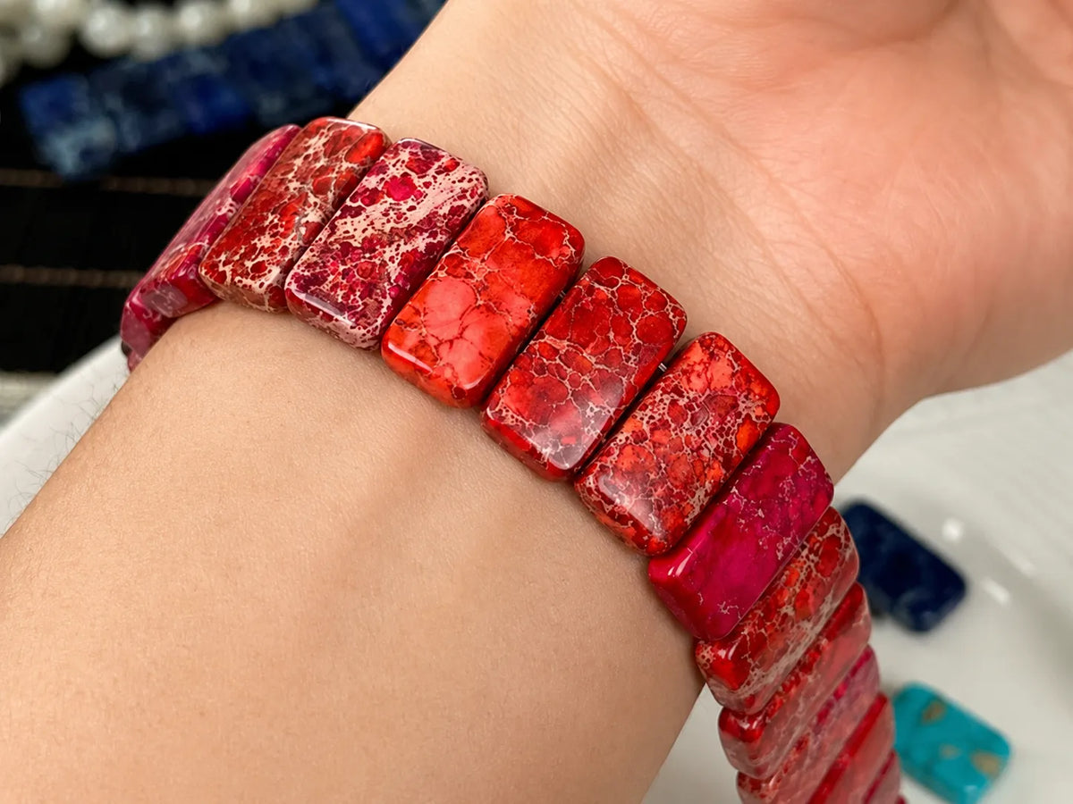 Red natural gemstone Apple Watch band worn on the wrist