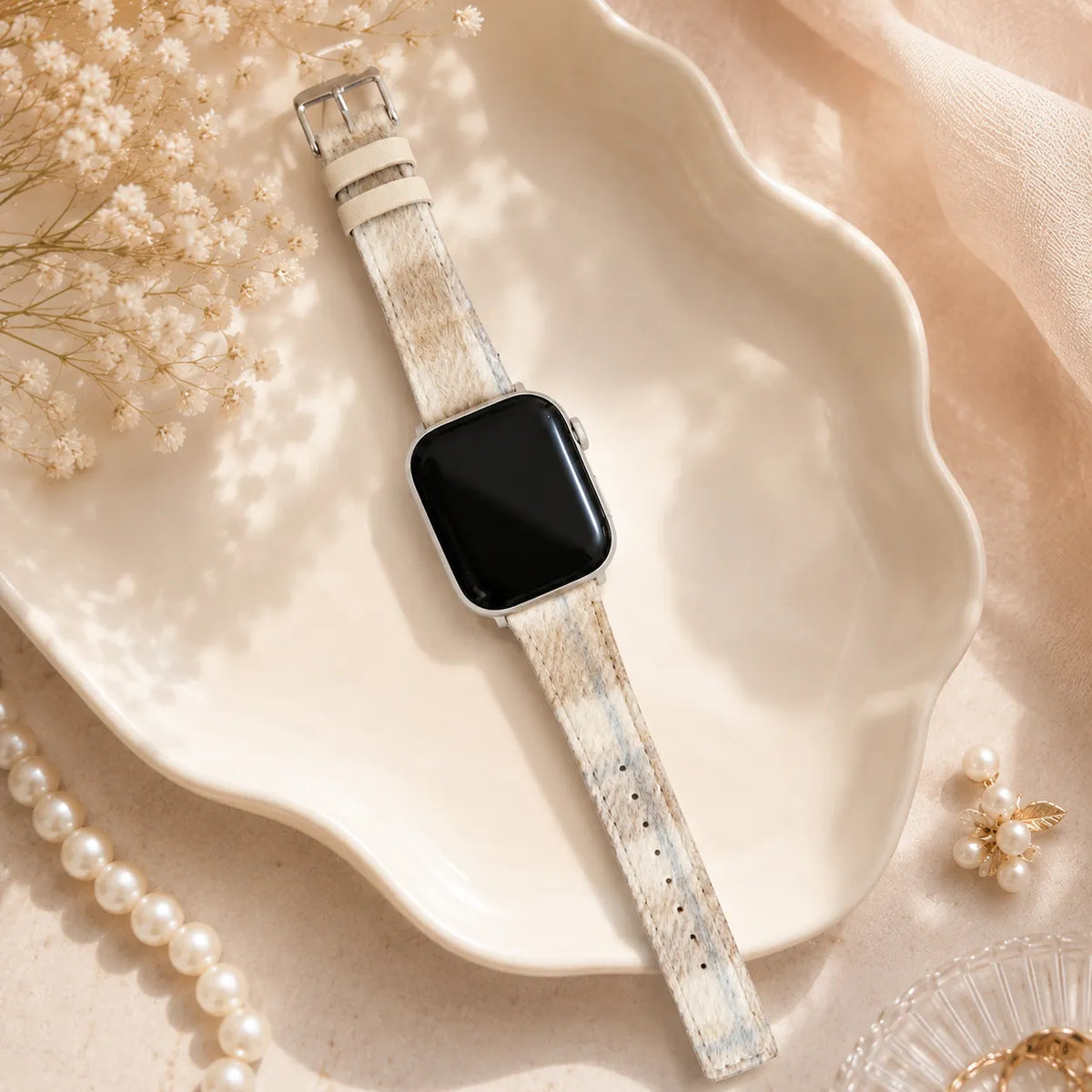 Cream lambswool tartan Apple Watch band with leather backing and pin buckle