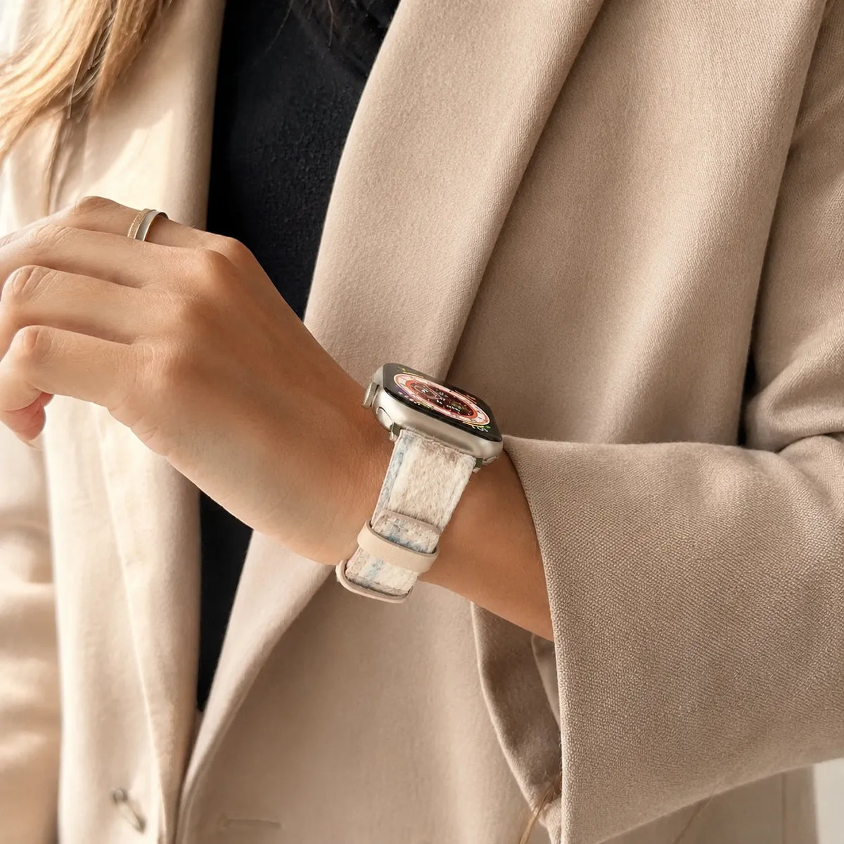 Cream tartan Apple Watch band styled with a neutral everyday outfit