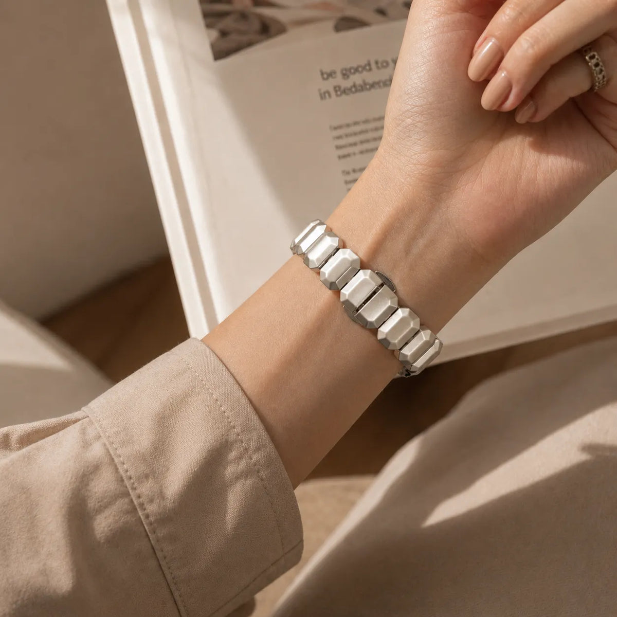 Inside view of the butterfly clasp and removable links on the cube link Apple Watch band